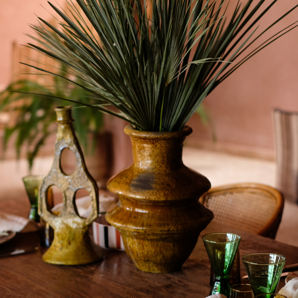 Tamegroute Vase Ochre on Dinner Table with Green Wine Glasses and Tamegroute Candle Holder